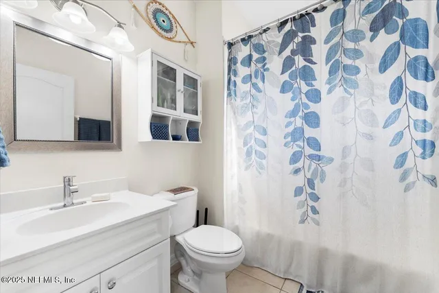 a bedroom with bed and a couch