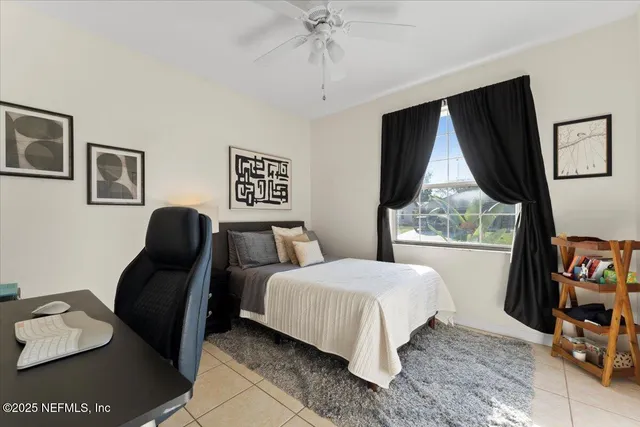 a bathroom with a sink a large mirror and a bathtub