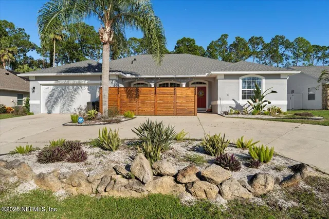 a view of a chair and tables in the patio