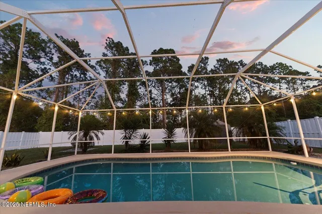 a swimming pool with outdoor seating