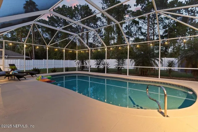 an aerial view of residential houses with city view