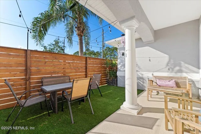 an aerial view of a house with garden space and street view