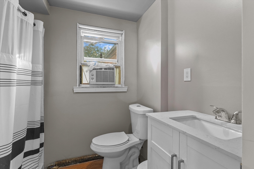 46 Staaf Road Saugus, MA 01906 - Photo 11 of 19 a bathroom with a sink toilet and window