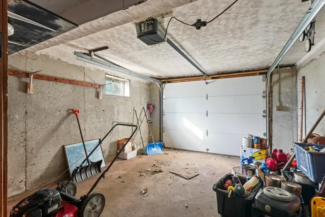 a view of a garage with rack and white walls