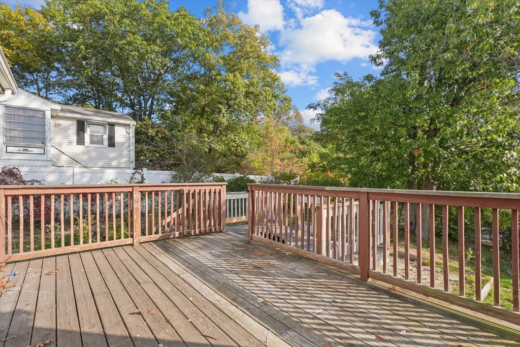 46 Staaf Road Saugus, MA 01906 - Photo 19 of 19 a balcony with wooden floor and fence