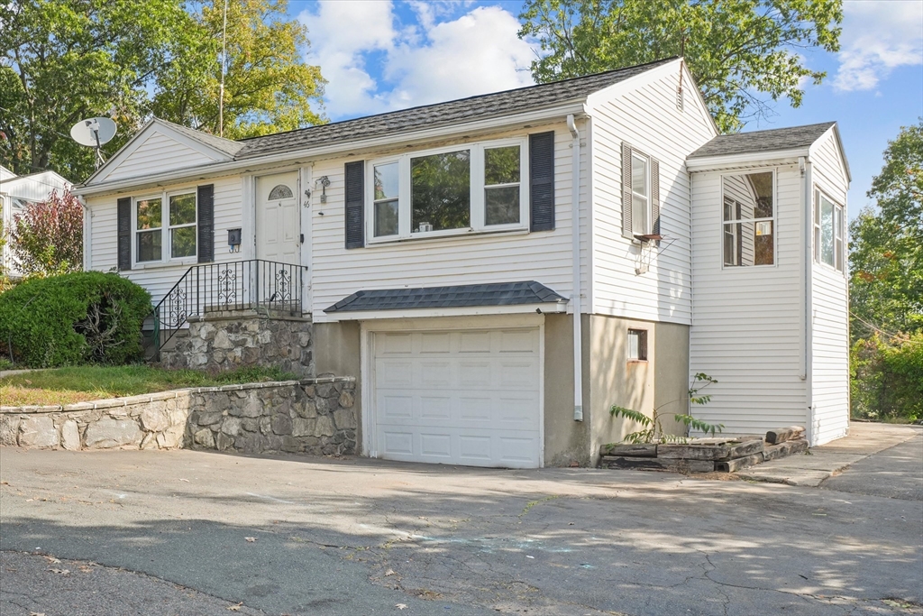 46 Staaf Road Saugus, MA 01906 - Photo 2 of 19 a front view of a house with a parking area