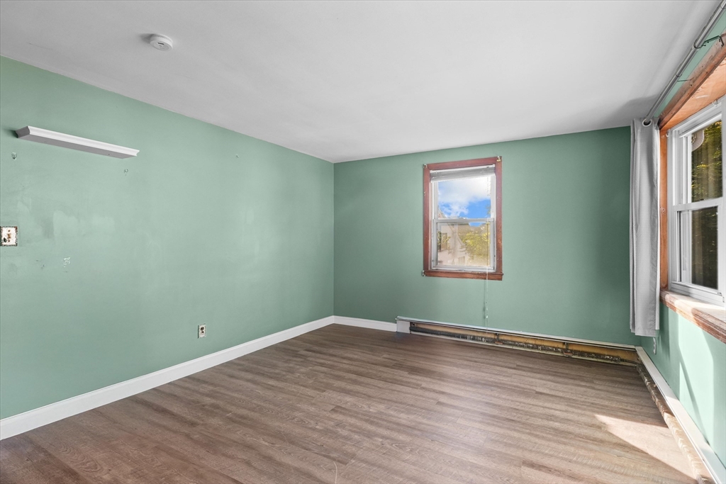46 Staaf Road Saugus, MA 01906 - Photo 4 of 19 an empty room with wooden floor and windows