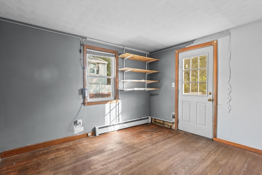 46 Staaf Road Saugus, MA 01906 - Photo 10 of 19 an empty room with wooden floor and windows