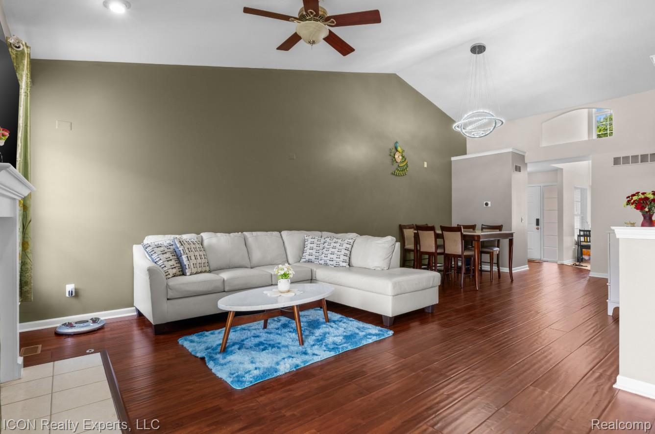 531 Cherry Grove Road Canton, MI 48188 - Photo 11 of 30 Spacious living area featuring wood-finish flooring and a vaulted ceiling