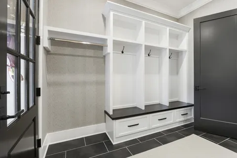 a utility room with sink dryer and washer