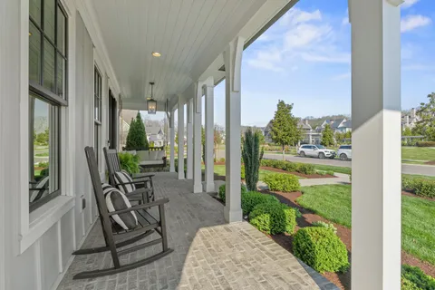 a view of an chairs and table in balcony