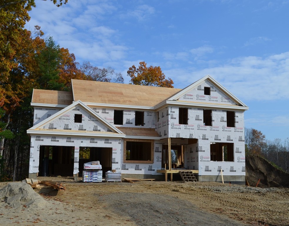 Lot 8 Monsen Road Concord, MA 01742 - Photo 1 of 16 a front view of a house with cars parked