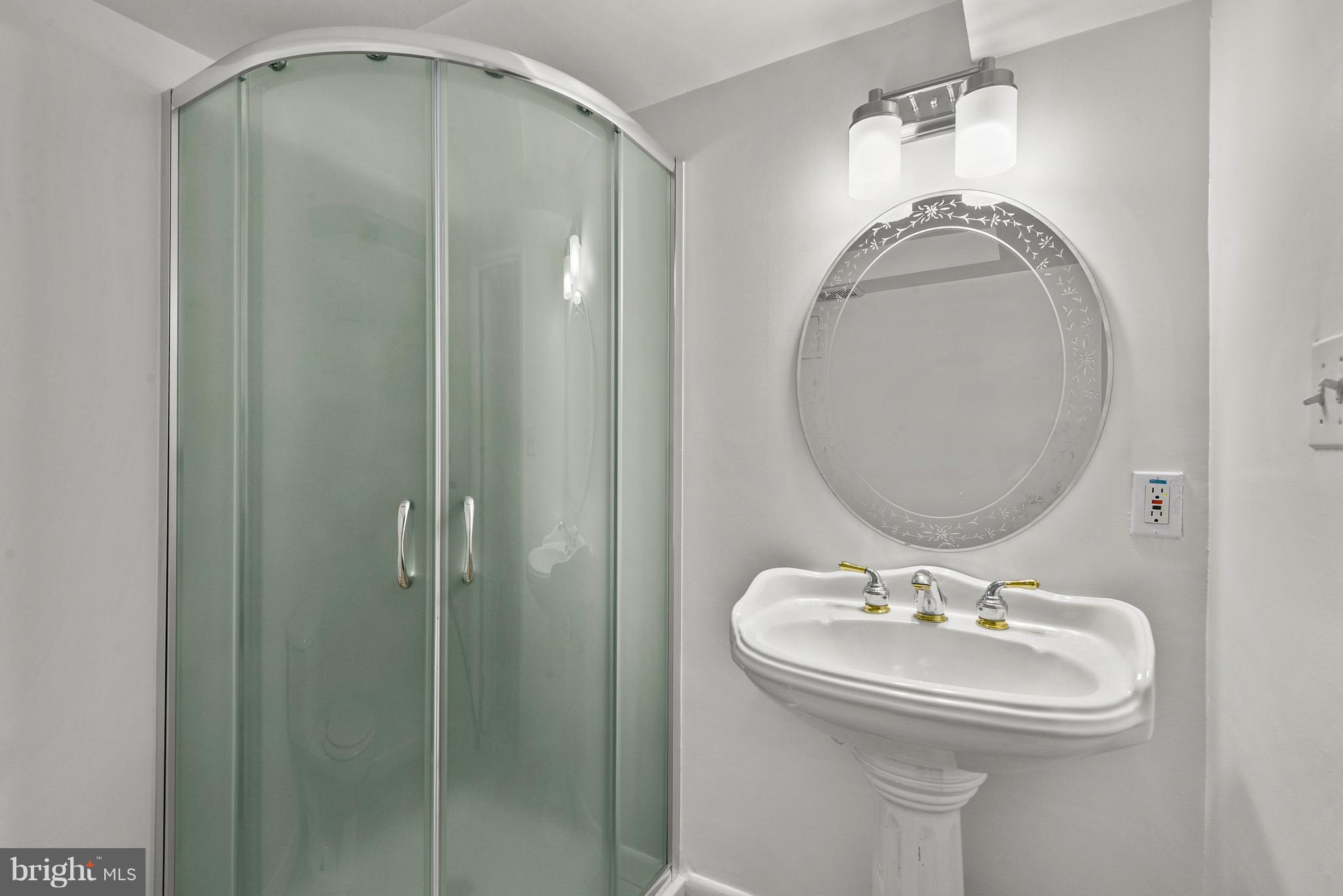 9411 Warren Street Silver Spring, MD 20910 - Photo 39 of 55 FULL BATH WITH SHOWER & PEDESTAL SINK