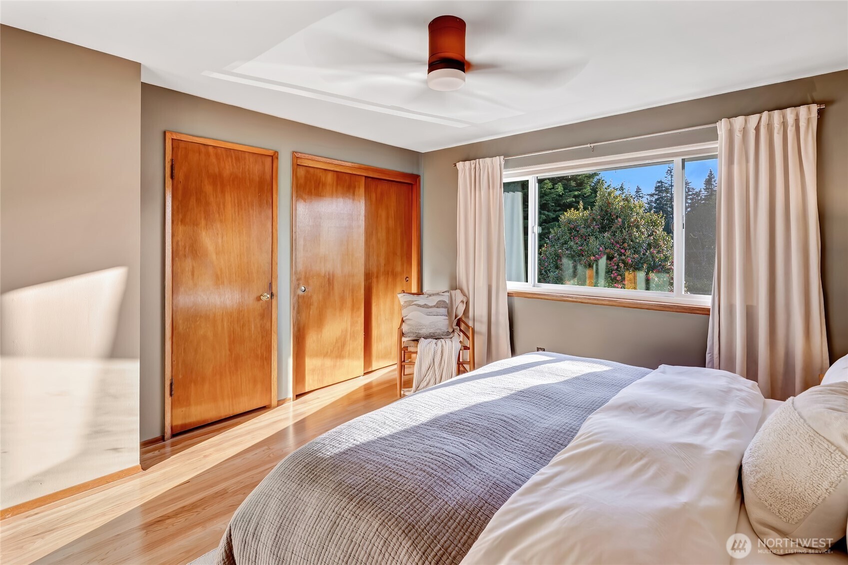 7571 45th Avenue Southwest Seattle, WA 98136 - Photo 25 of 40 a bedroom with a bed and a large window