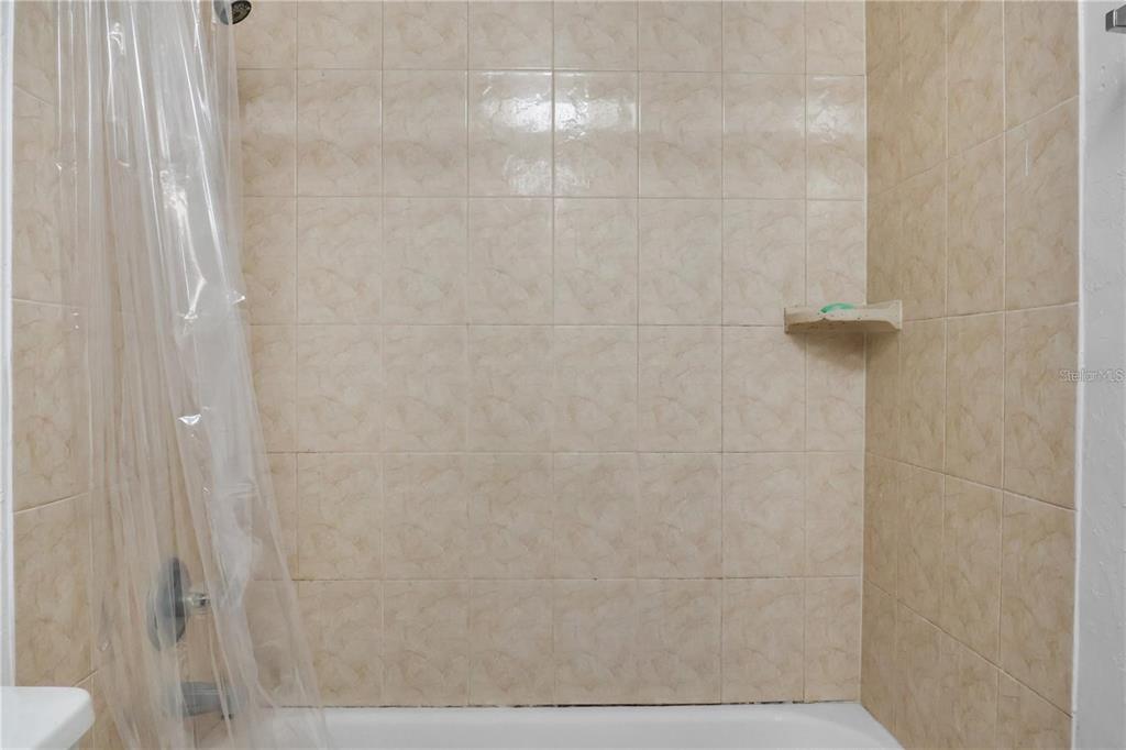 713 Southwest 69th Street Gainesville, FL 32607 - Photo 14 of 22 a bathroom with a shower