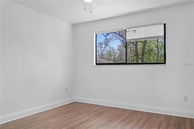 a small white house with a table and chairs