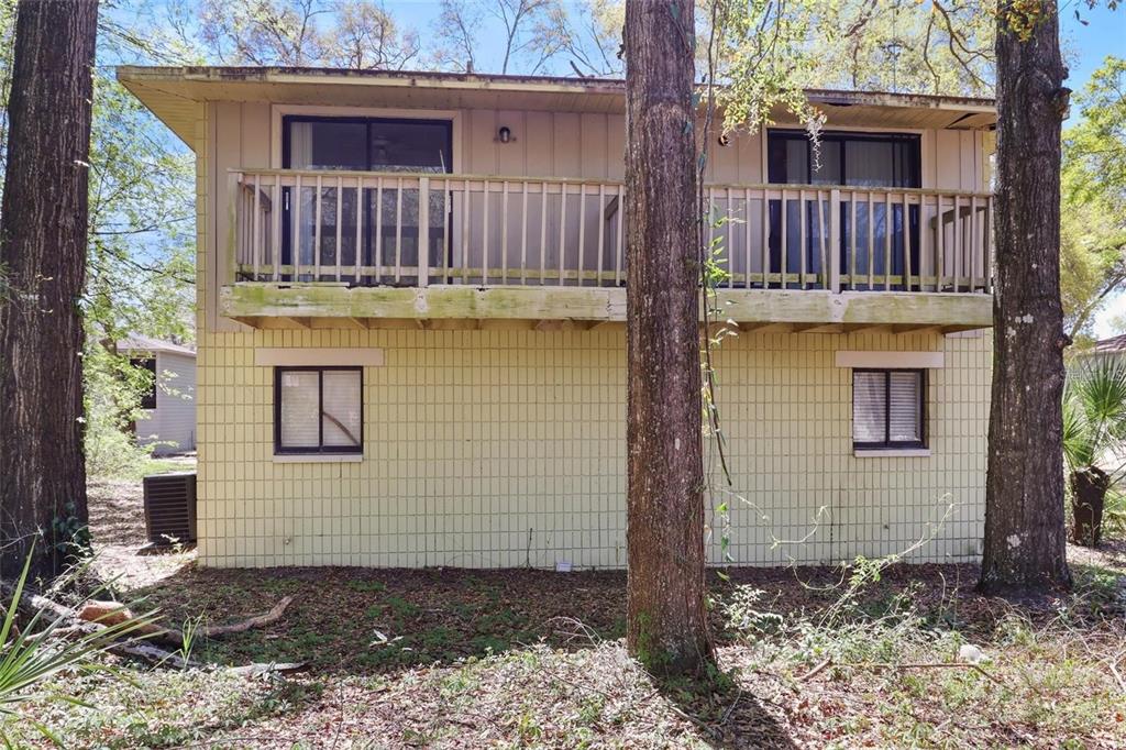713 Southwest 69th Street Gainesville, FL 32607 - Photo 21 of 22 a view of a house with roof deck