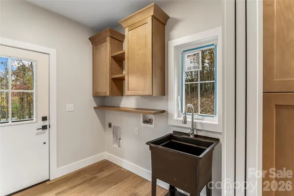 a kitchen with granite countertop a stove and a sink