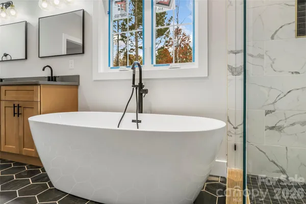 a living room with a couch and chandelier