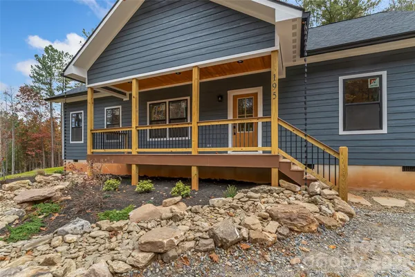 a house with trees in the background