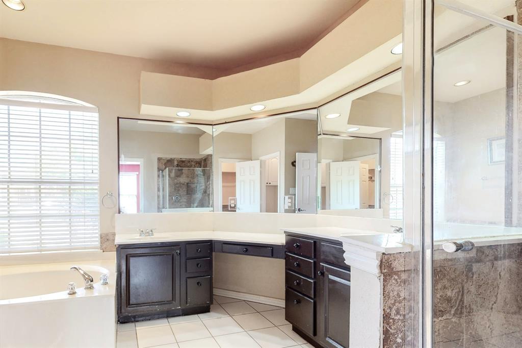 119 Parkhurst Lane Allen, TX 75013 - Photo 13 of 24 a bathroom with a granite countertop sink and a bathtub