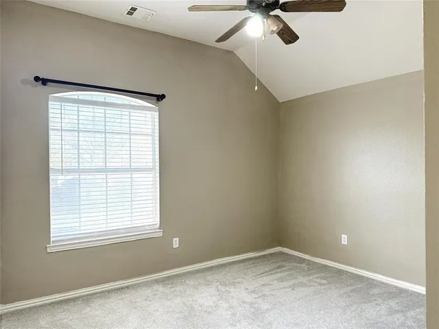 a bathroom with a sink mirror and a shower