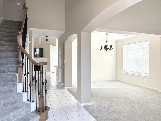 a view of a hallway with windows