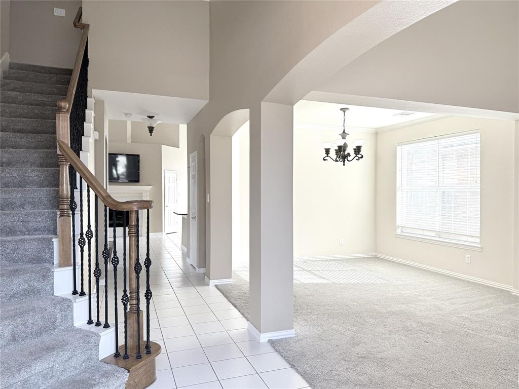 119 Parkhurst Lane Allen, TX 75013 - Photo 3 of 24 a view of a hallway with windows