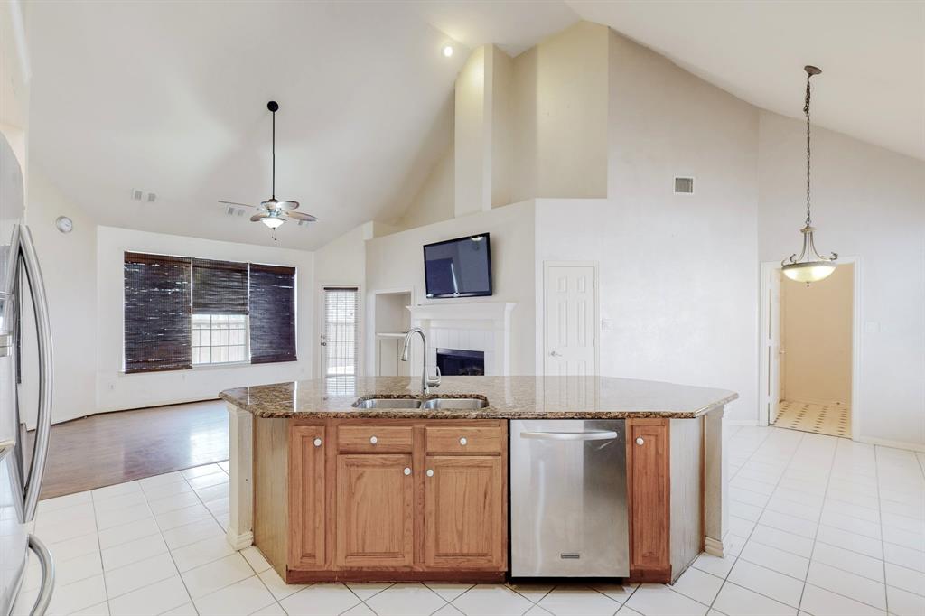 119 Parkhurst Lane Allen, TX 75013 - Photo 24 of 24 a kitchen with kitchen island a counter top space a sink stainless steel appliances and cabinets