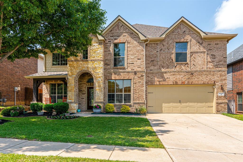 5009 Shelly Ray Road Fort Worth, TX 76244 - Photo 1 of 1 a front view of a house with a yard and garage