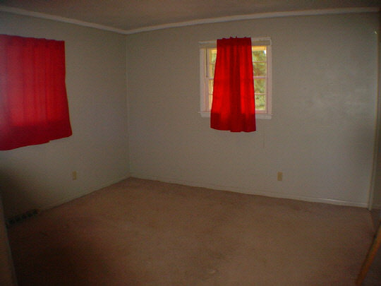 1013 Kenmore Road Rockford, IL 61108 - Photo 3 of 6 an empty room with a window