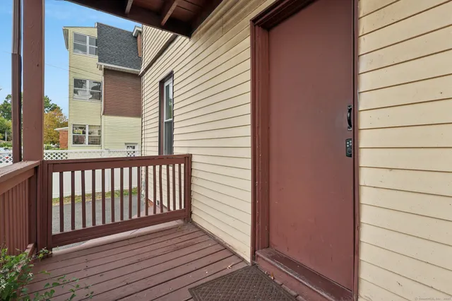 a view of a cars park in front of a building