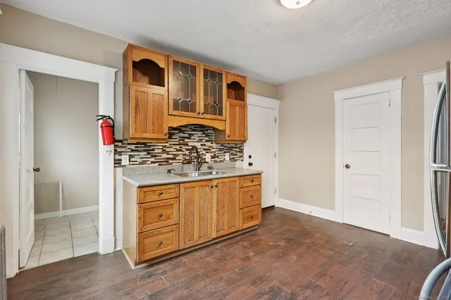 a view of kitchen with cabinets and wooden floor