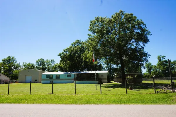 a view of three park benches and a slide