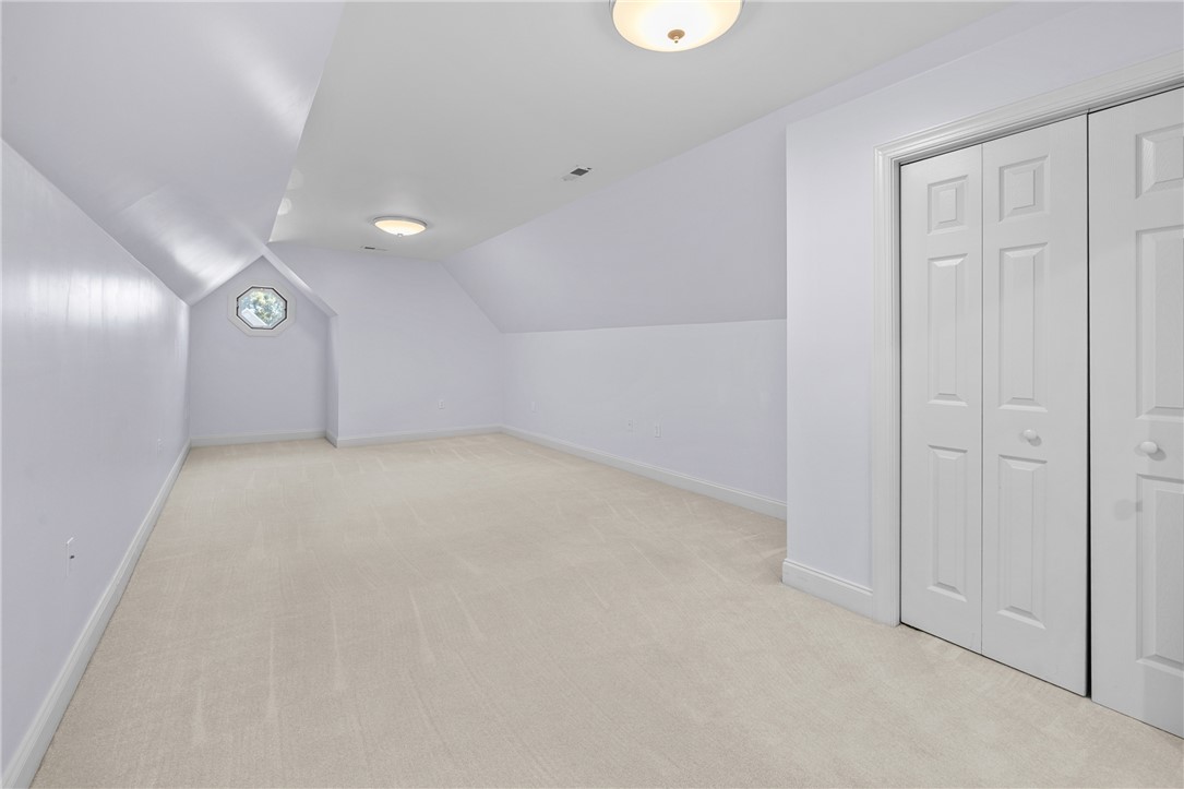 110 Brookstone Way Central, SC 29630 - Photo 34 of 46 This spacious attic room offers abundant potential with its unique window and neutral carpeting.
