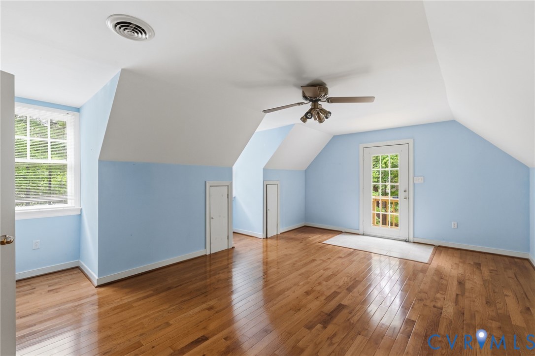 2615 Salisbury Road Midlothian, VA 23113 - Photo 27 of 36 an empty room with wooden floor fan and windows
