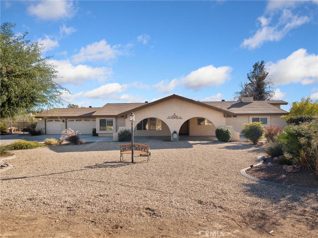 19435 Seneca Road Apple Valley, CA 92307 - Photo 1 of 1 a front view of a house with a yard
