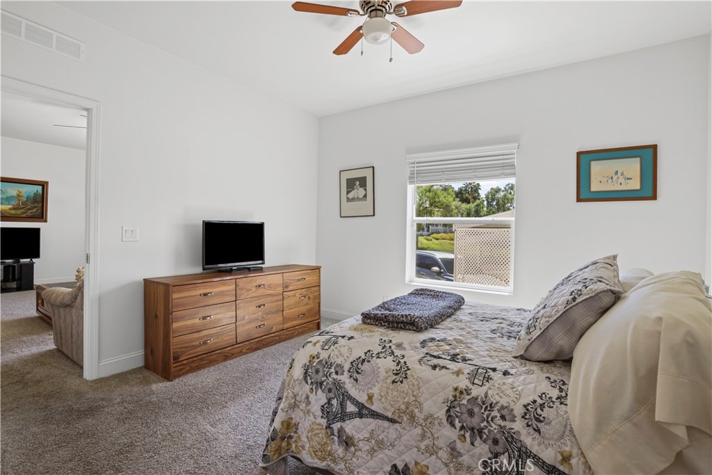 1700 South State Street, Unit 19 Hemet, CA 92543 - Photo 22 of 34 a bedroom with a bed and a television