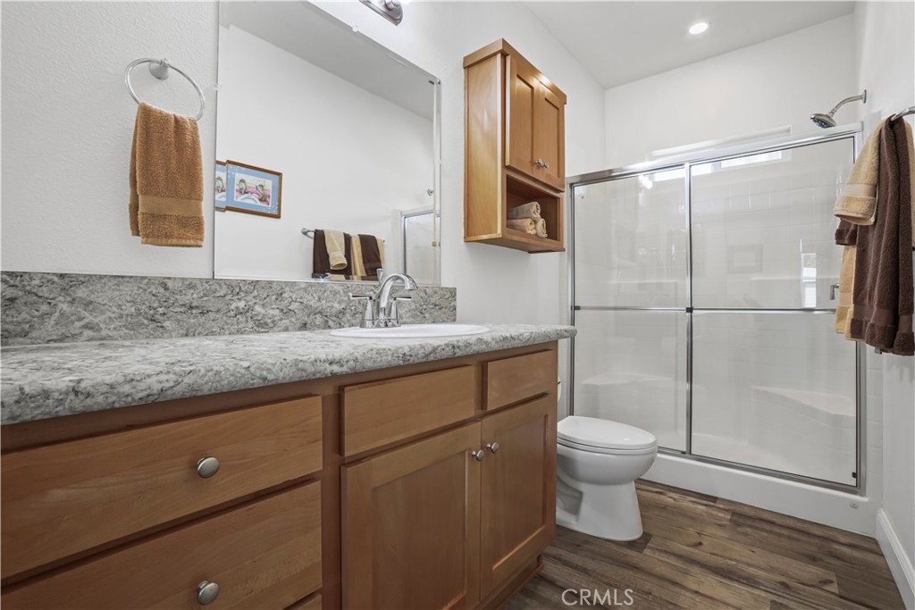 1700 South State Street, Unit 19 Hemet, CA 92543 - Photo 23 of 34 a bathroom with a granite countertop sink toilet and shower
