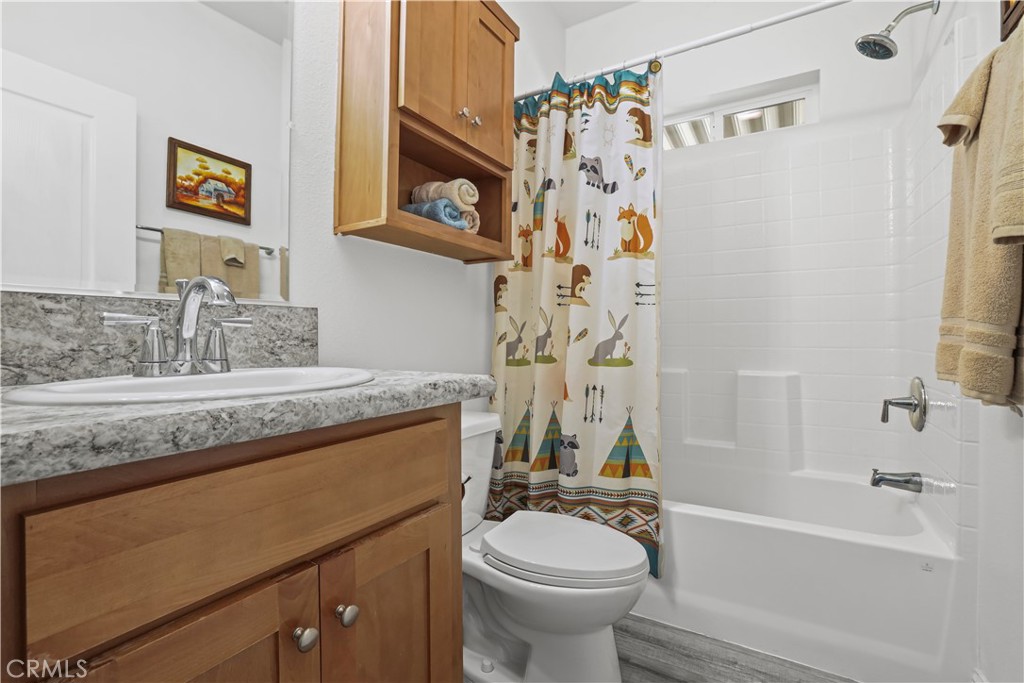 1700 South State Street, Unit 19 Hemet, CA 92543 - Photo 28 of 34 a bathroom with a granite countertop sink toilet and shower