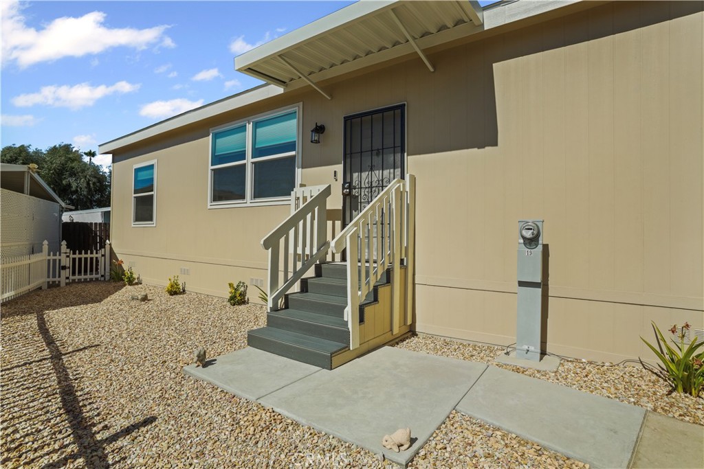 1700 South State Street, Unit 19 Hemet, CA 92543 - Photo 3 of 34 a view of a house with wooden floor and fence