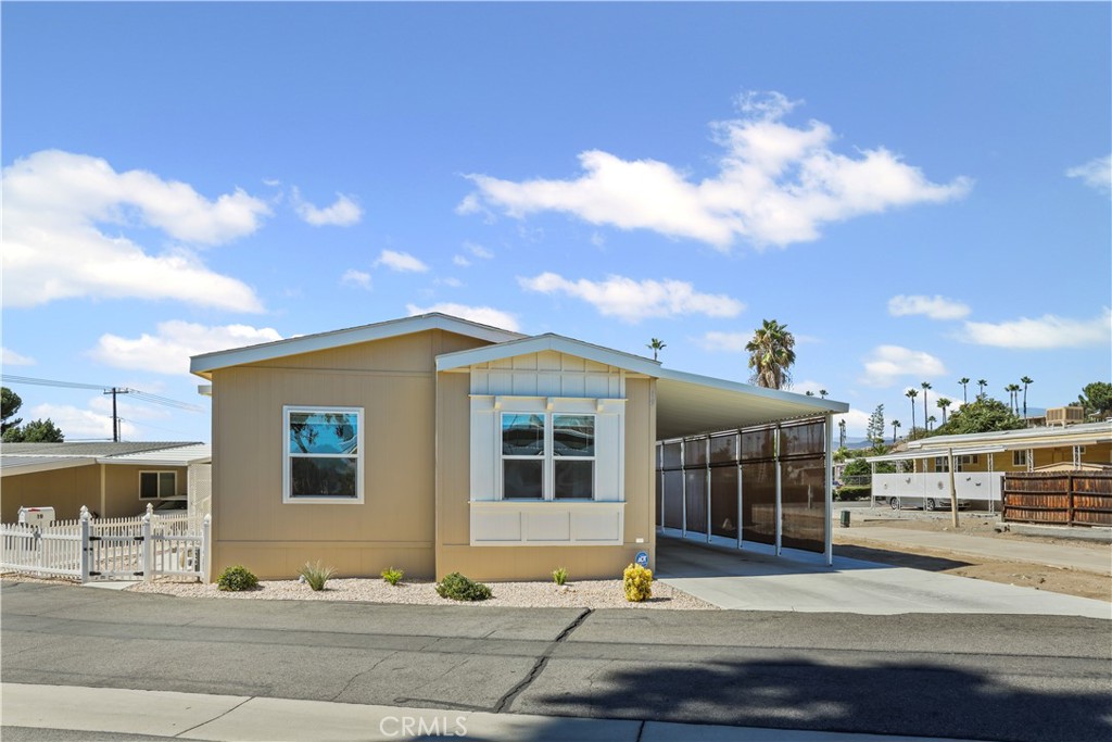 1700 South State Street, Unit 19 Hemet, CA 92543 - Photo 5 of 34 a front view of a house with a yard