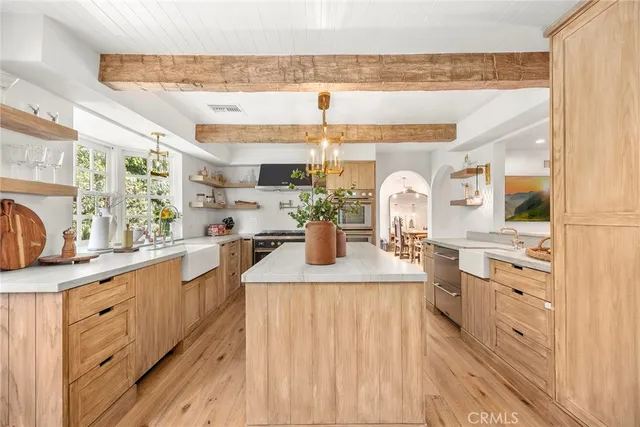 a view of a storage and utility room with washer and dryer