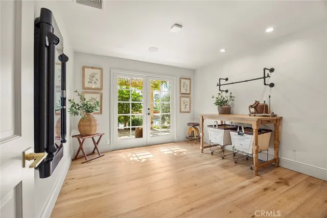 a spacious bathroom with a granite countertop double vanity sink a mirror and a shower