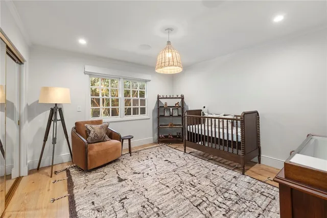 a view of walk in closet with clothes