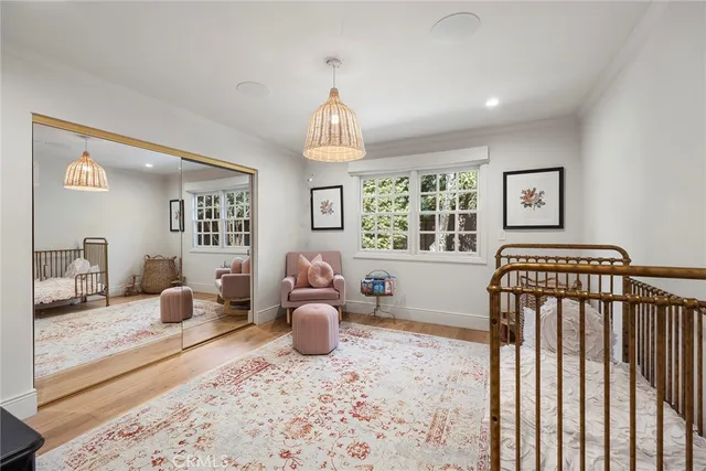 a living room with furniture a flat screen tv and potted plant