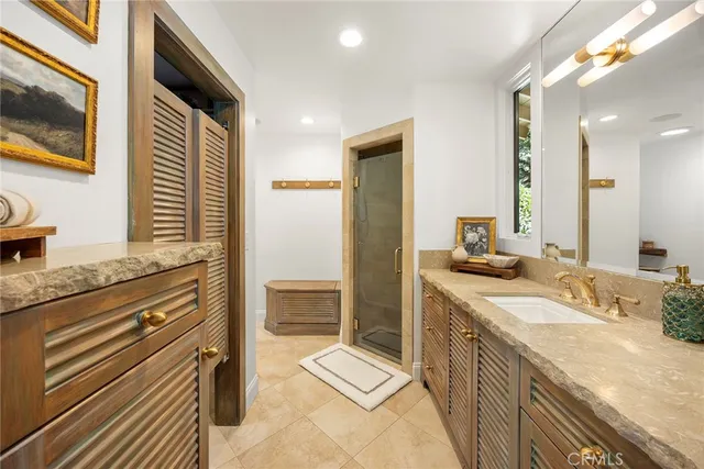 a view of a patio with a table and chairs under an umbrella