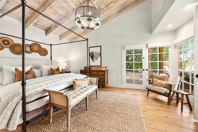 a view of a backyard with plants and a patio