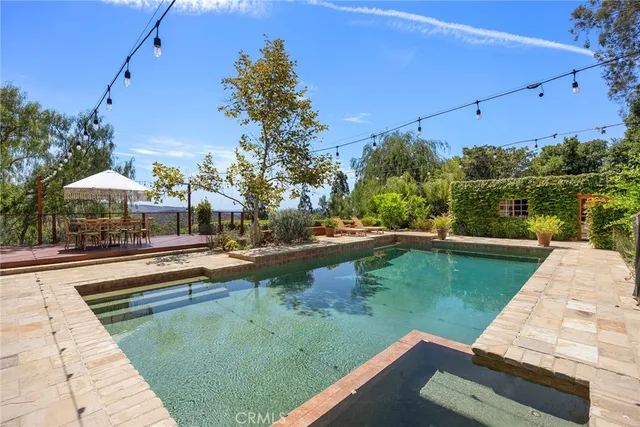 an aerial view of a house with yard