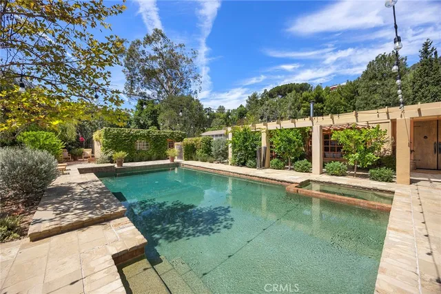 an aerial view of a house with yard swimming pool and outdoor seating